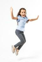 Happy schoolgirl jumping high on white background photo