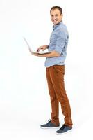 Business man with a laptop - isolated over a white background photo