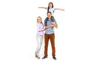 family and people concept - happy smiling mother, father and little daughter over white background photo