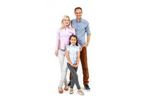 Happy young family with pretty child posing on white background photo