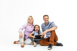 cheerful family using tablet computer isolated on white photo