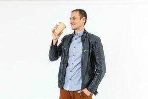 Profile side photo of funky positive middle eastern man hold take way cup with coffee have free time after work enjoy rest wear white outfit isolated over pastel color background