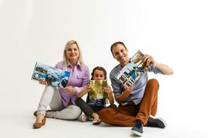 family with photo books white background