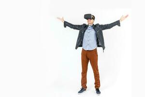Full length portrait of an amazed guy using a virtual reality headset isolated on white background photo