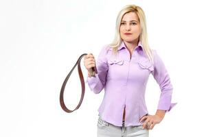 woman holds a belt on a white background photo