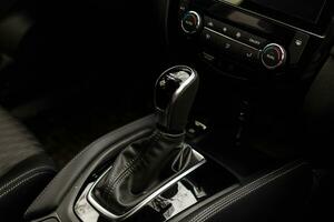 Gear shift handle in a modern car, closeup photo