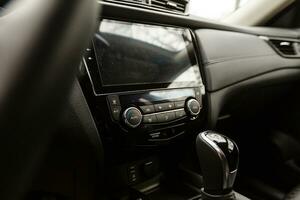 Modern car interior with dashboard and multimedia photo