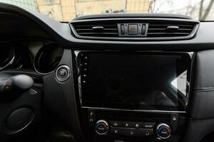 Modern car interior with dashboard and multimedia photo