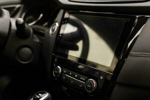 Modern car interior with dashboard and multimedia photo