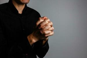 Praying Hands on a black background photo