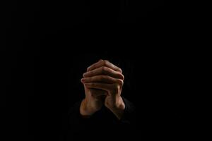 Praying Hands on a black background photo