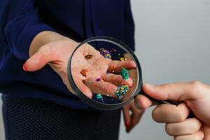 Hygiene concept. Man is showing dirty hands with many viruses and germs. photo