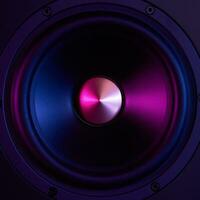 Sound speaker on dark background with neon lights photo