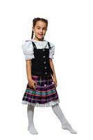 Cute little kid girl in traditional Bavarian costume over white background photo