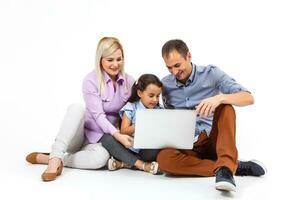 Parents and Daughter Using Laptop photo