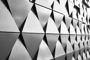 resumen arquitectura detalle. gris pared fachada con geométrico modelo foto