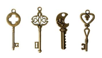 Antique bronze keys, isolated on white or transparent background. photo