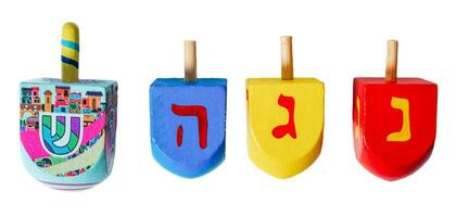 Wooden dreidels for Hanukkah isolated on white or transparent background. photo