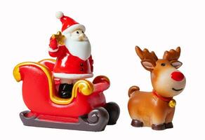 Christmas tree and Santa Claus in sleigh with reindeer isolated on white or transparent background. photo