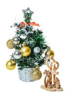 Wooden nativity scene and Christmas tree isolated on white or transparent background. photo