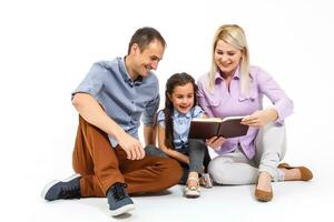 cheerful family using tablet computer isolated on white photo