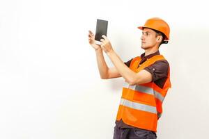 Worker protecting his ears from the noise photo