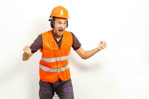 Worker protecting his ears from the noise photo