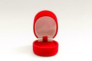 Red velvet box for the ring, opened, isolated over the white background photo