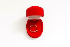 wedding rings in a gift box on white background photo