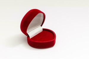 Red velvet box for the ring, opened, isolated over the white background photo