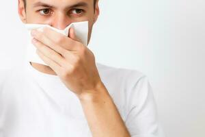 young man who is bothered by a bad smell photo