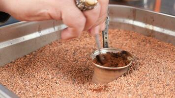 top view of making traditional turkish coffee on sand video