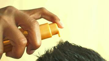 men applying oil on hair video