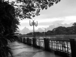 Silhouette in the sunset by the river Black and white photography photo