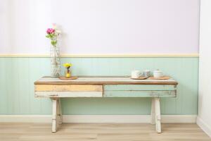 regenerado madera banco agrega calor a un desgastado elegante cocina en pastel colores. ai generado foto