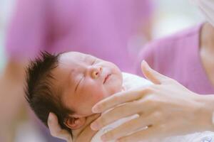 The Baby boy was just born with Baby cloth wrapped around the whole body photo