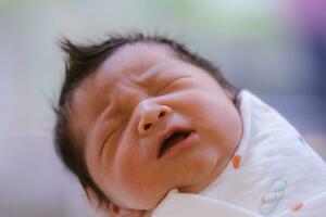 The Baby boy was just born with Baby cloth wrapped around the whole body photo