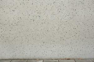 Concrete wall texture with exposed aggregate. Texture, background, pattern. Ai generative photo