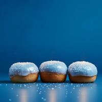 ai generado Janucá rosquillas con en polvo azúcar en un azul antecedentes. foto