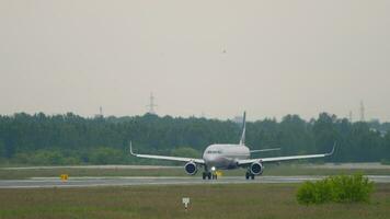 NOVOSIBIRSK, RUSSIAN FEDERATION JUNE 10, 2020 Civil airplane of Aeroflot taxiing at Tolmachevo airport. Airliner on the taxiway. Plane on the airfield. Tourism and aviation concept video