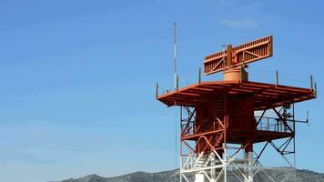 Tower with radar gyrating in airport at sunny day video