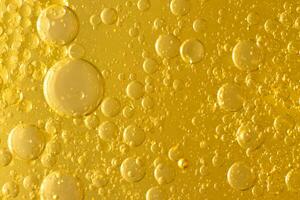 Oil bubble texture on gold background. photo