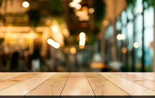 Empty wooden table top with lights bokeh on blur restaurant background photo