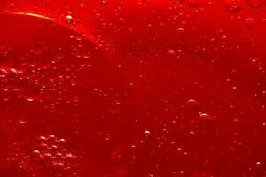 Water bubble texture on red background photo