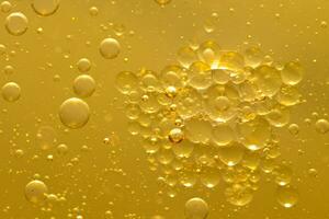 Oil bubble texture on gold background. photo