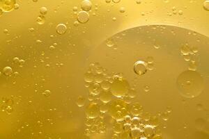 Oil bubble texture on gold background. photo