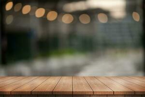 Empty wooden table top with lights bokeh on blur restaurant background. photo
