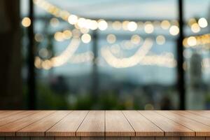 Empty wooden table top with lights bokeh on blur restaurant background. photo
