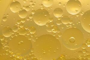 Oil bubble texture on gold background. photo