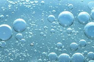 Water bubble texture on blue background photo